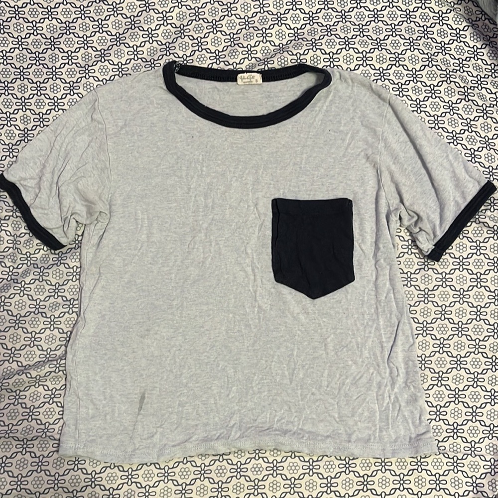 Selling: Light blue with dark blue pocket and lining, t-shirt. Size small.